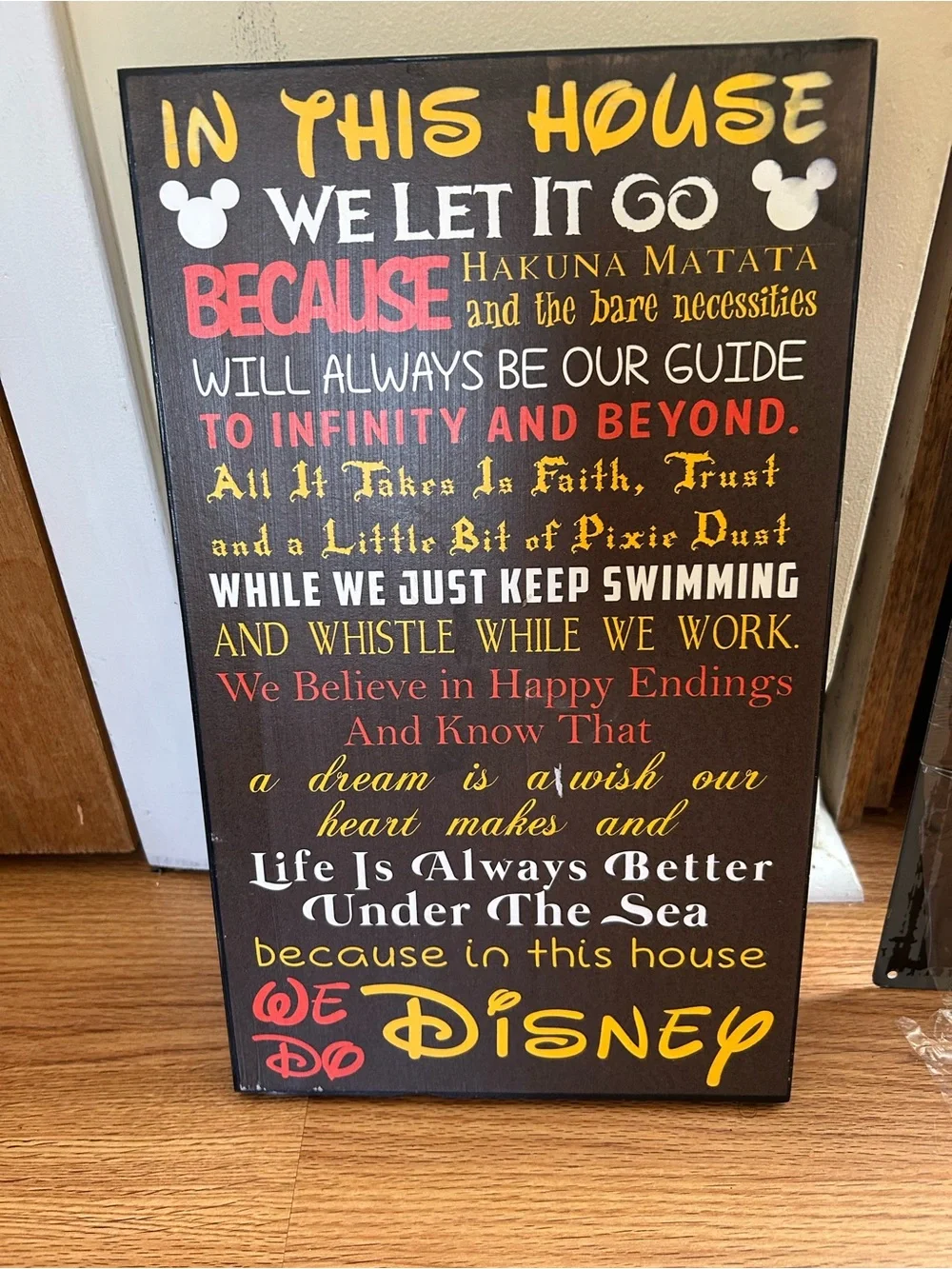 In This House We Do Disney Wall Art - Yellow, Red, White Text on Brown